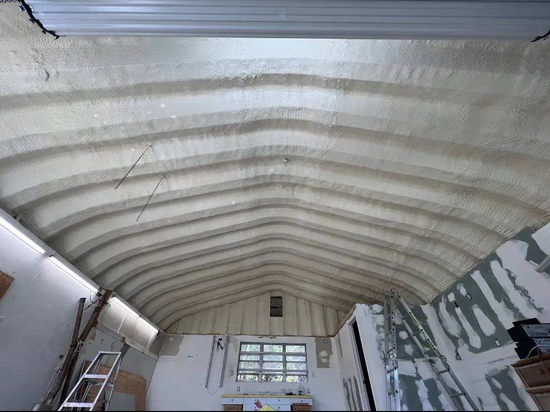 Spray polyurethane foam applied to the underside of a metal roof deck in June Park